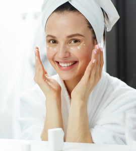 Woman applying Anti-Aging Moisturizer to her face