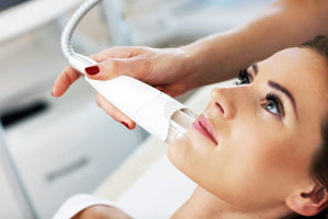 Woman receiving oxygen facial